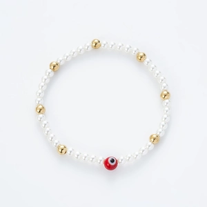 Pulsera de perlas hecha a mano con detalles dorados y dije de ojo turco rojo para parejas