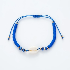 Detail of handmade bohemian blue Heishi bead bracelet with natural shell and adjustable cord