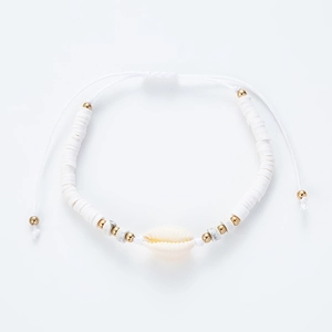 Adjustable beach bracelet with white heishi beads, gold accents and natural seashell