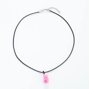 Detail of pink resin bear pendant on black leather cord necklace with lobster clasp