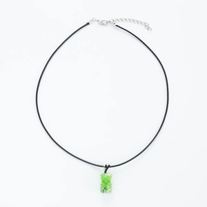 Minimalist stainless steel bear pendant necklace with green resin and black cord strap