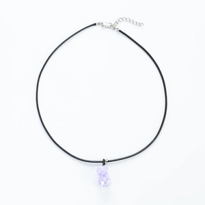 Detail of lavender resin gummy bear pendant on a black cord necklace with lobster clasp