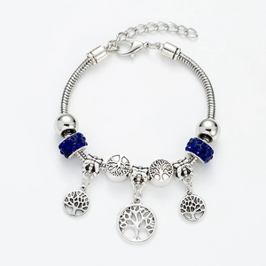 Silver tree of life charm bracelet with blue crystal beads on a snake chain