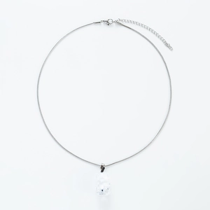 Detail view of the silver S-chain with lobster clasp and clear resin gummy bear pendant