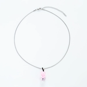 Close-up of pink resin gummy bear pendant with silver snake chain and lobster clasp