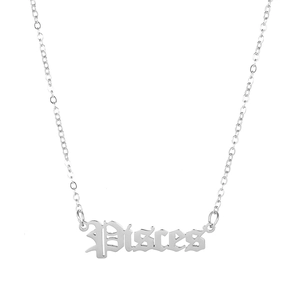 Macro view of silver Gothic 'Pisces' zodiac pendant on a fine stainless steel chain