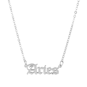 Close-up of Aries zodiac pendant necklace with Gothic font in silver titanium steel