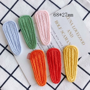 Set of 6 colorful knitted hair clips 68x27mm in vibrant shades on a display card