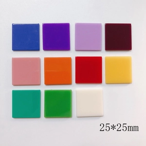 Flat lay macro of colorful 25x25mm square resin beads for DIY jewelry making accessories