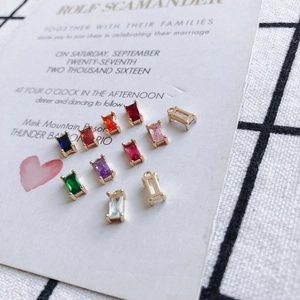 Close-up of colorful rectangular zircon charms with gold plating for DIY jewelry making