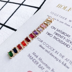Macro view of rectangular geometric copper pendants with colorful zircon in eleven vibrant colors