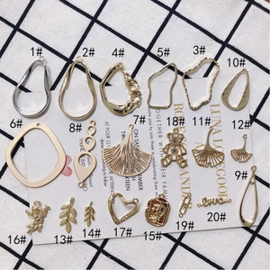 Collection of 20 gold and silver alloy DIY jewelry pendants featuring bears and leaves