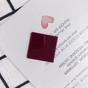 Close-up of wine red square resin pendant for DIY jewelry making accessories