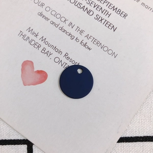 Close-up of navy blue matte geometric circular alloy pendant for DIY earring making