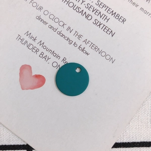 Detailed view of dark cyan matte round alloy pendant charm with precise top hole for DIY