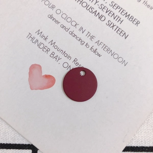 Macro detail of dark red matte alloy round pendant for DIY jewelry earring making