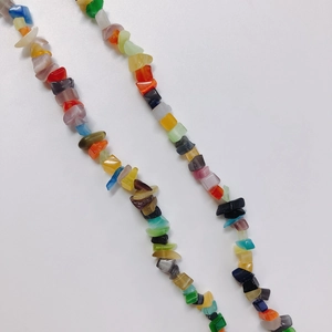 Detailed macro view of colorful polished irregular resin beads for DIY jewelry making
