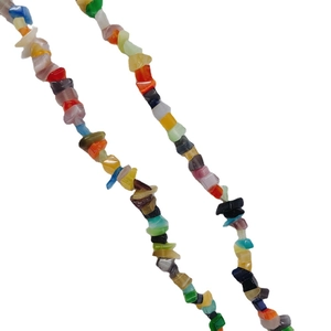 Colorful bohemian style crushed stone beaded necklace set against a clean white background