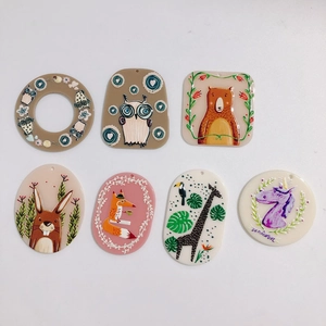 Detailed set of 7 cartoon animal acrylic charms including owl bear and unicorn designs