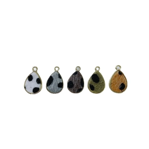 Five assorted animal print teardrop pendants with gold metal edges for jewelry making