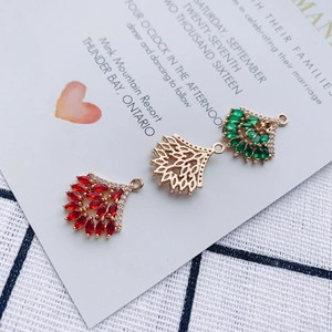 Detailed set of fan-shaped alloy charms with rhinestones in red, green and gold colors