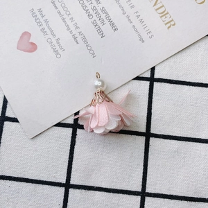 Detail of pink fabric flower pendant with white pearl and gold filigree cap for DIY jewelry