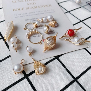 DIY pearl pendants with gold wire wrapping in various shapes for jewelry making