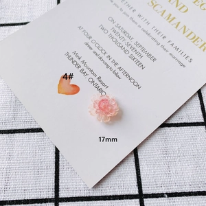 Detail showing 17mm pink acrylic flower petal charm with translucent layered texture