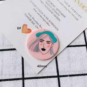 Detailed view of 40mm pink acrylic pendant featuring a minimalist artistic portrait