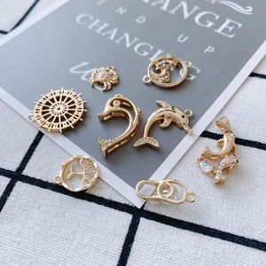 Gold-plated marine charms with zircon-inlaid dolphin and crab shapes for jewelry DIY