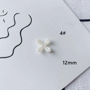 Detail of 12mm pearl white four-petal flower acrylic bead for DIY jewelry craft