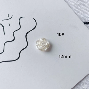 Detail view of a 12mm white acrylic rose flower bead for DIY jewelry making accessories