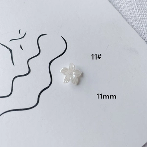 Detail view of 11mm white acrylic five-petal flower bead for DIY jewelry making