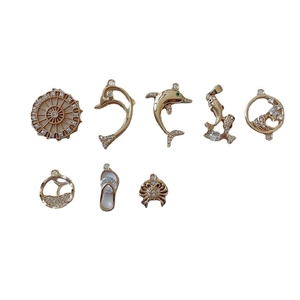 Gold plated ocean charms set with dolphin and crab pendants for DIY jewelry making