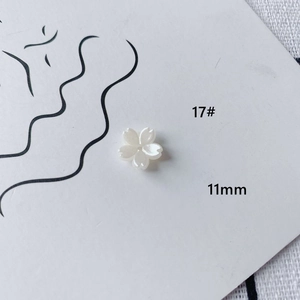 Detail of 11mm white cherry blossom acrylic bead with pearl luster for DIY jewelry