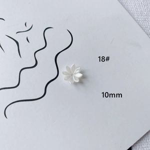Macro shot of 10mm white acrylic rose flower beads for DIY jewelry making accessories