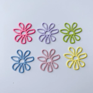 Detailed view of six colorful hollow daisy charms in various sweet summer candy colors