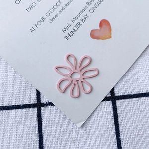 Detailed macro shot of a sweet pink hollow flower accessory for DIY jewelry making