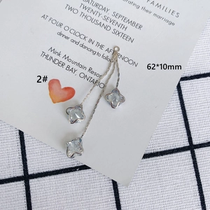Detail view of 62x10mm long tassel earrings with light blue star-shaped zircon in silver