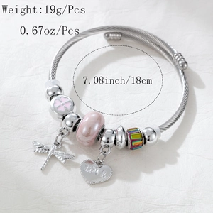Detail of silver beaded bracelet featuring pink floral beads and love heart charm