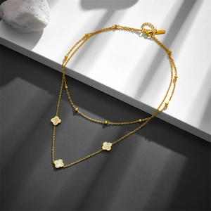 Double-layered gold stainless steel necklace with white clover shell pendants