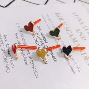 Detail of colorful enamel heart earrings accessories with gold hanging loops for DIY jewelry