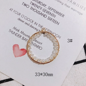 Detail of 33x30mm gold wire-wrapped circular pendant with crystal beads for DIY jewelry