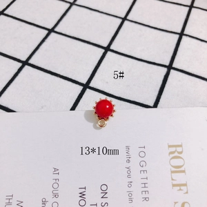 Detail of red bead pendant with gold metal base for DIY jewelry making, 13x10mm size