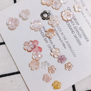 Carved flower-shaped shell beads for DIY jewelry making in multiple natural colors