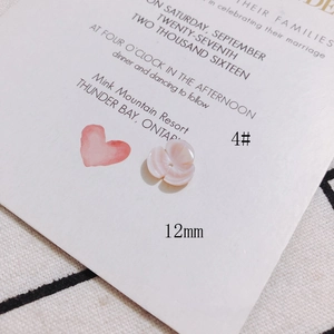 Detail of 12mm pink shell flower charm with pearlescent finish for DIY jewelry