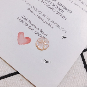 Macro detail of 12mm pink mother of pearl shell flower bead for DIY jewelry making