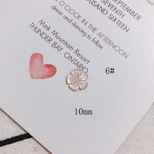 Detail view of 10mm pink shell plum blossom bead for DIY jewelry making and craft projects