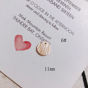 Detail of 11mm fan-shaped shell charm with natural pearl luster for DIY jewelry making