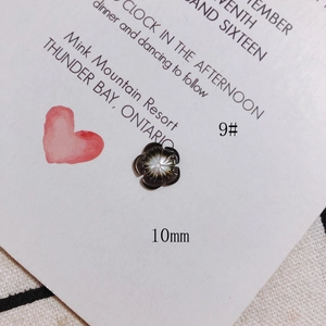 Macro shot of 10mm flower shell jewelry accessory with radial lines for DIY crafting
